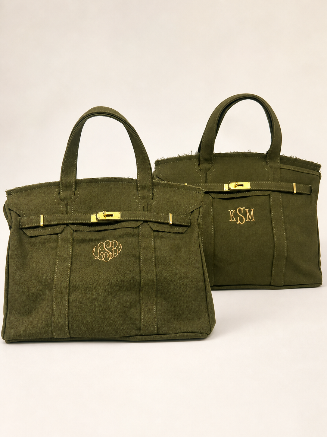 Two olive-green canvas bags with custom embroidered monograms