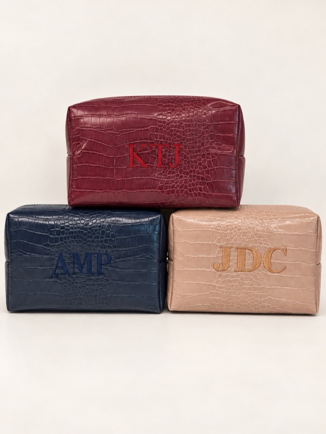 Embossed travel case trio