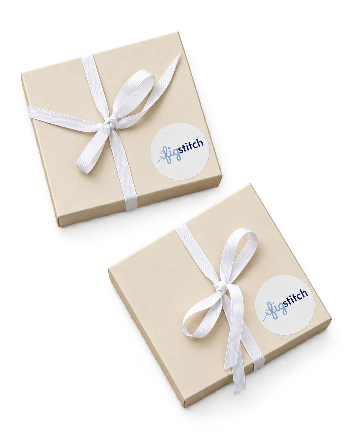 Ivory Figstitch gift boxes finished with white ribbon and branded seals