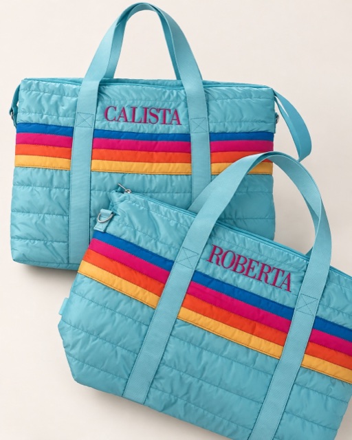 Turquoise quilted travel bags with rainbow stripes and embroidered names