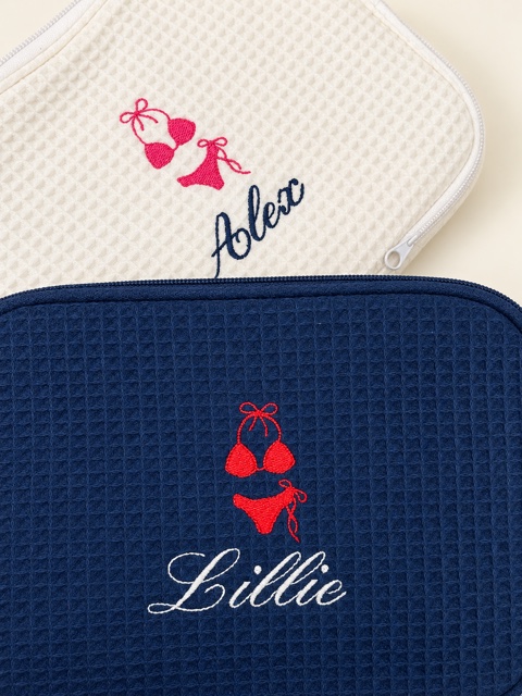 White Alex and navy Lillie waffle zip cases with pink and red bikini embroidery.